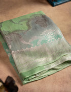 Banarasi Tussar Saree in Pastel Green with Multicolour Rangat Patterns and Silver Thread Border